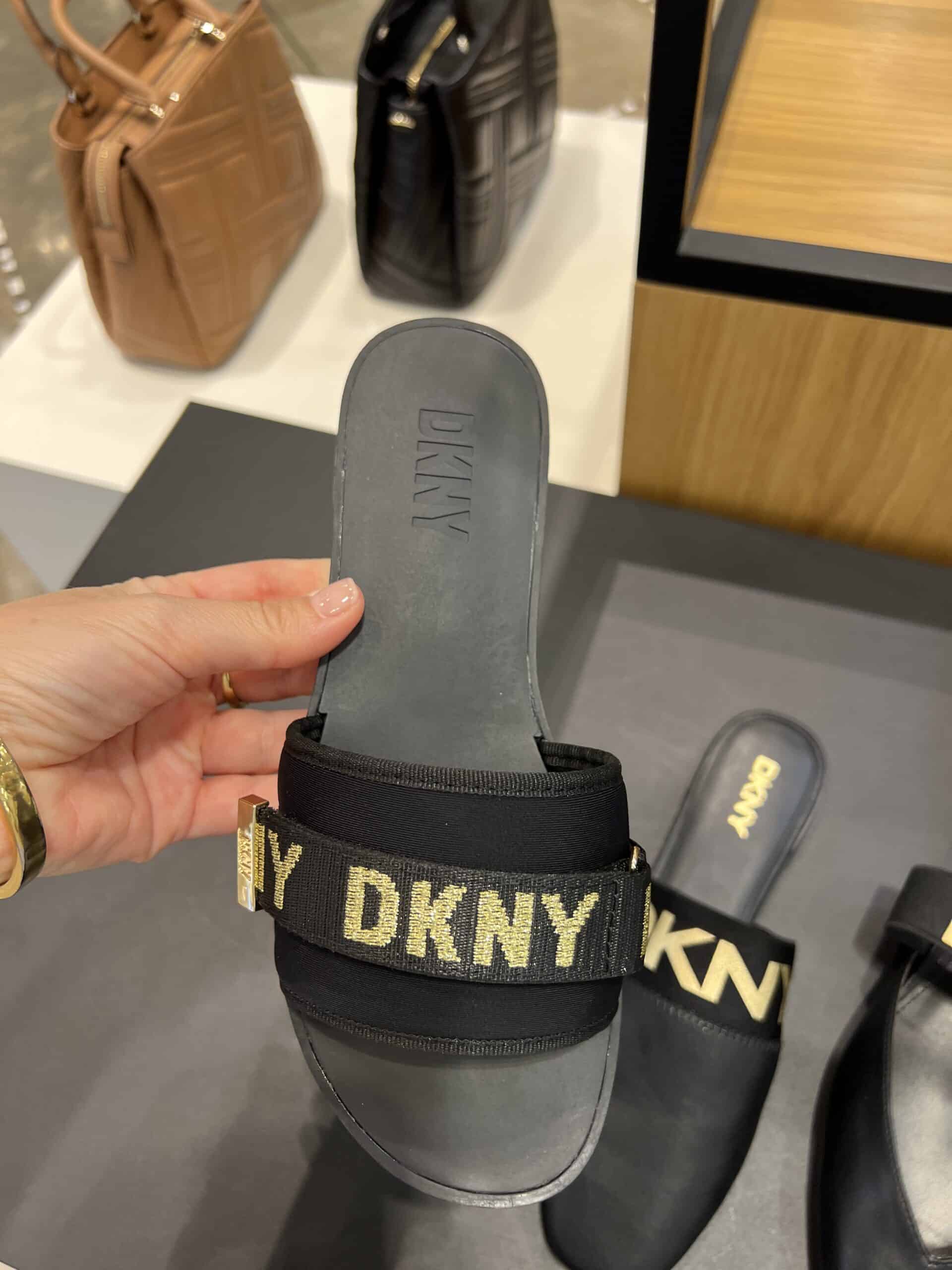 retail women ss23 flat sandals slide mule pointy leather prints lettering metals black dkny 2